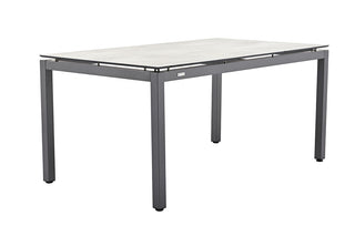 Der MWH Dining-Tisch Royal Comper 160x90 verfügt über ein modernes graues rechteckiges Design mit kratzfester Oberfläche, dünnen Metallbeinen und einer minimalistischen Ästhetik.